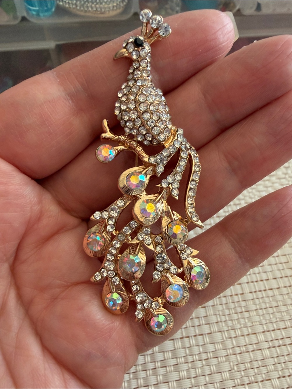 Gold-Tone Peacock Brooch with Iridescent Crystal Accents